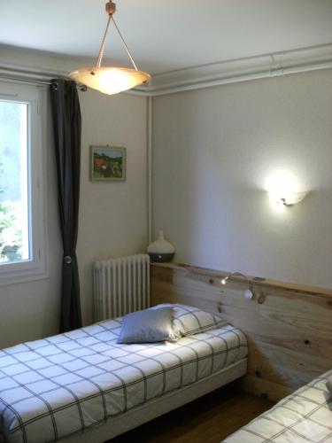 Postel nebo postele na pokoji v ubytování Chez Léontine