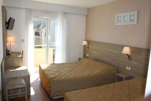 Кровать или кровати в номере Hotel Des Tilleuls