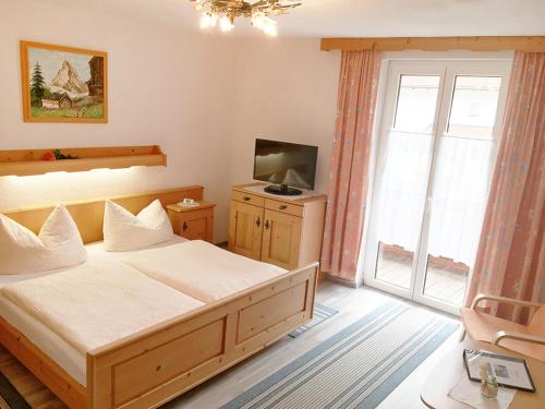 מיטה או מיטות בחדר ב-Haus Adlerkanzel