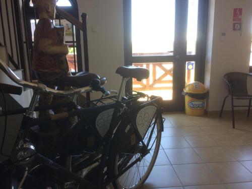 a bike parked in a room with a window at Ekomarina - Pokój noclegowy 2 in Węgorzewo