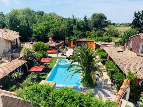 an aerial view of a resort with a swimming pool at GuestHouse Le Patio34 in Lavérune