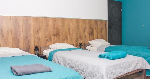 Łóżko lub łóżka w pokoju w obiekcie Noclegi CS17