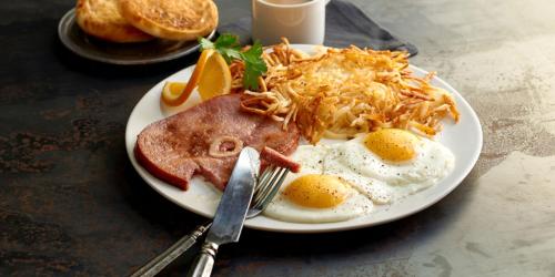 a plate of breakfast food with eggs bacon and cheese at Wyndham San Diego Bayside in San Diego