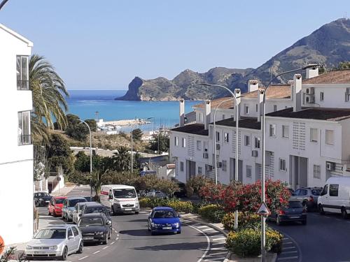 a view of a street with cars parked on the road at FH COCOLISO I in Altea
