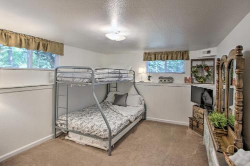 a bedroom with a bunk bed and a tv at Hot Tub and Fireplace Peaceful Anderson Island Home in Johnson Landing