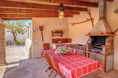 a kitchen with a table and a stove at La Font - Vallem Properties in Pollença