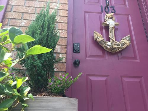 a purple door with a cross on it at Southern Sophistication at Hickory in Ladson