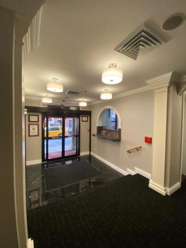 a room with a hallway with a waiting room at Hotel 31 Extended Stay in New York