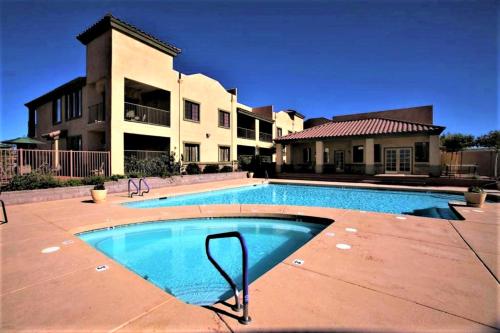 a large swimming pool in front of a house at Highlands Resort at Verde Ridge in Cottonwood
