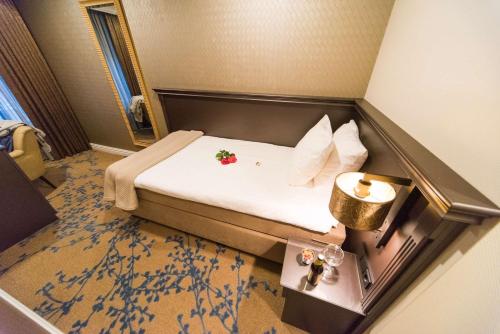 Кровать или кровати в номере Good Seasons Hotel Den Bosch