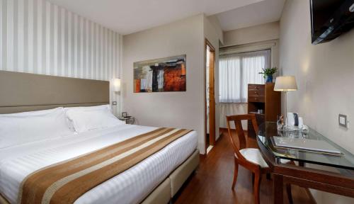 Ένα ή περισσότερα κρεβάτια σε δωμάτιο στο Best Western Hotel Piccadilly