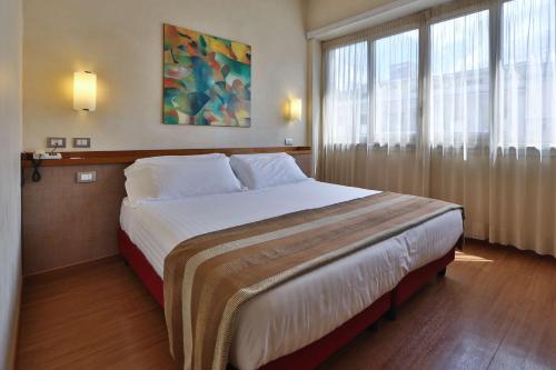 Ένα ή περισσότερα κρεβάτια σε δωμάτιο στο Best Western Hotel Piccadilly