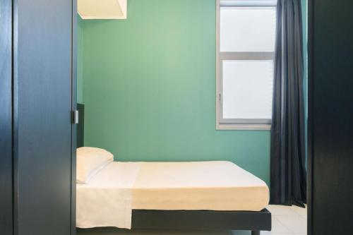 Postel nebo postele na pokoji v ubytování Executive Business Hotel