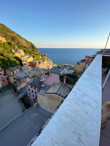 a view of a city from the roof of a building at Giadera penthouse 5terreparco in Riomaggiore