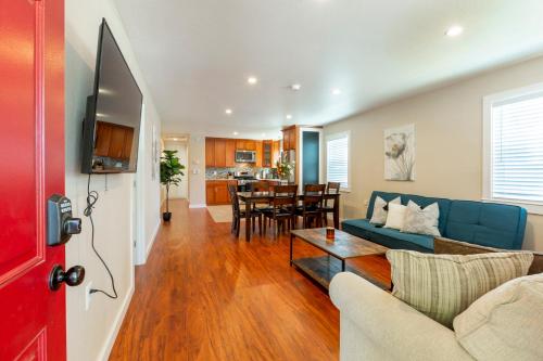 a living room with a blue couch and a table at @ Marbella Lane 3BR Upper Level House in Downtown San Jose in San Jose
