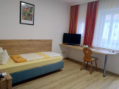 TV a/nebo společenská místnost v ubytování Hotel Fortuna