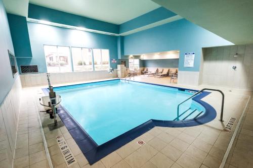 a large swimming pool in a building at Holiday Inn Express Alpharetta - Roswell by IHG in Alpharetta