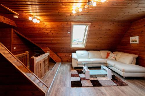 a living room with a couch and a table at Ferienhaus Stoiser in Sankt Stefan ob Stainz