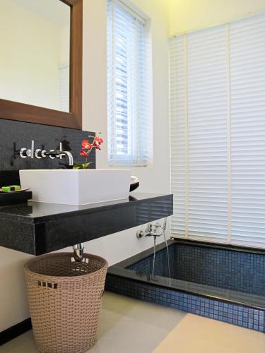 a bathroom with a sink and a mirror at Villa 3 Bedrooms with private pool at Oxygen Bangtao in Bang Tao Beach