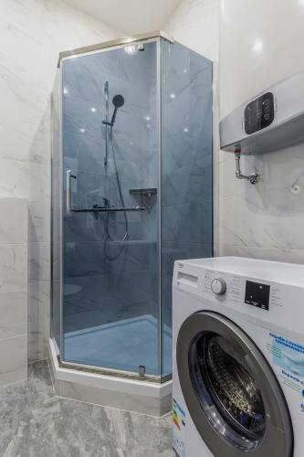 Ванная комната в barasport city apartments