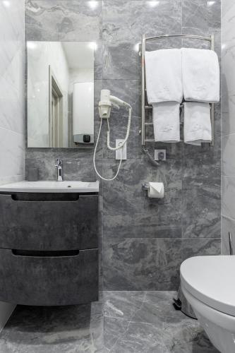 Ванная комната в barasport city apartments