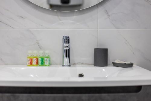 Ванная комната в barasport city apartments