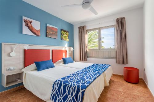 A bed or beds in a room at Hotel Floresta