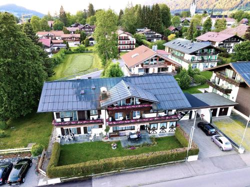 an aerial view of a house with a roof at Gästehaus Immenhof in Oberstdorf