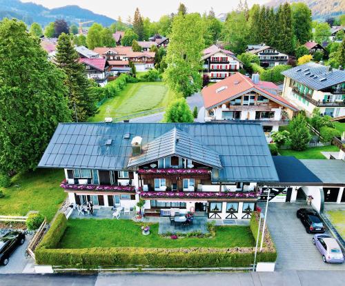 an aerial view of a house with a roof at Gästehaus Immenhof in Oberstdorf