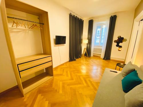 a living room with a dresser and a mirror at Crops City Stay in Trieste