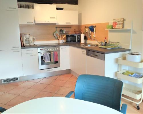 a kitchen with a sink and a stove top oven at Ferienwohnung Tischneck in Schramberg