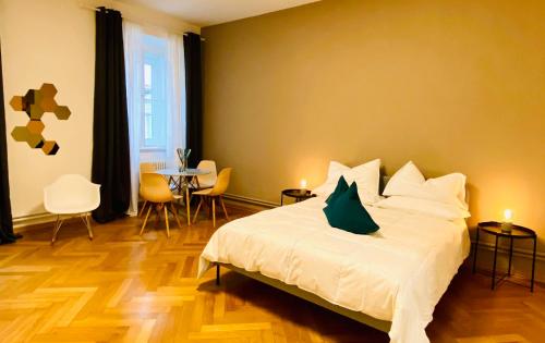 a bedroom with a bed and a table and chairs at Crops City Stay in Trieste