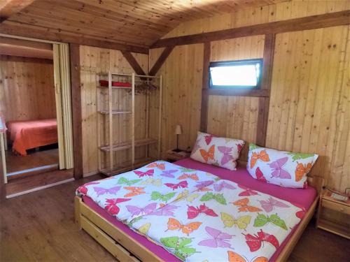 A bed or beds in a room at Ubytovani U Švýcarů