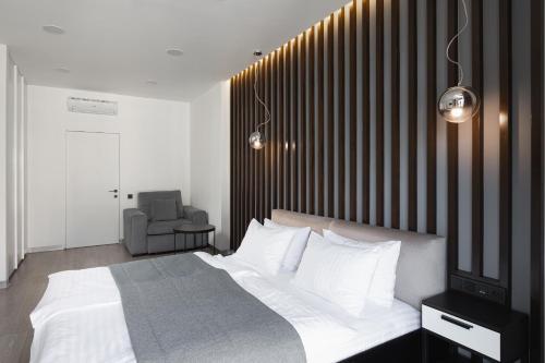Кровать или кровати в номере Beskyd Suites