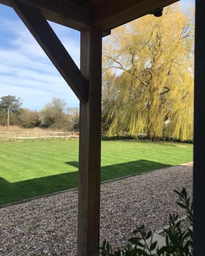 a view of a field from a window at Bell Lodge in Chichester