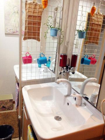 a bathroom with a white sink and a mirror at Stay Nikko Guesthouse in Nikko
