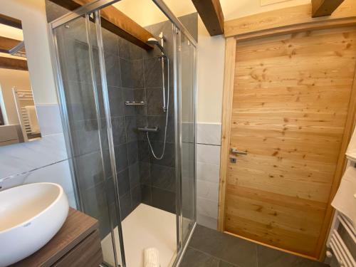 a shower with a glass door in a bathroom at B&B Torri di Veglia in San Domenico