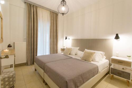 a bedroom with a large bed in a room at Pargas Dream in Parga