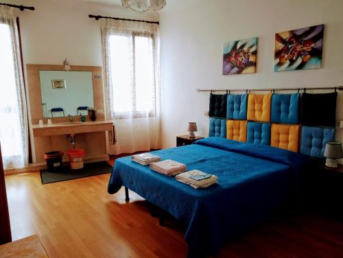Ένα ή περισσότερα κρεβάτια σε δωμάτιο στο Casa Favaretto Guest House