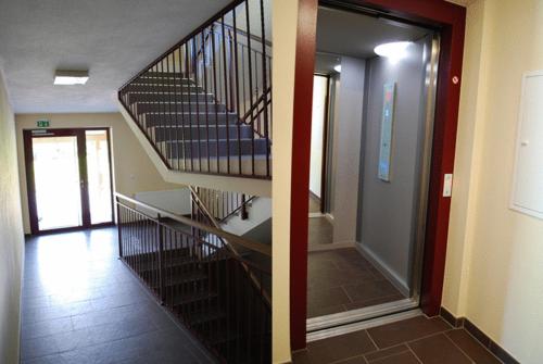 a staircase in a building with a hallway and a hallway at Residenz an der Burg by Kaprun Rentals in Kaprun