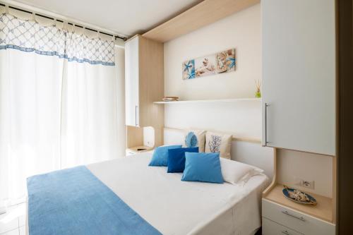 Кровать или кровати в номере Mavip Residence
