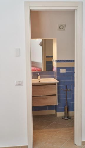 a bathroom with a sink and a mirror at Maiori Dream House 1 in Maiori