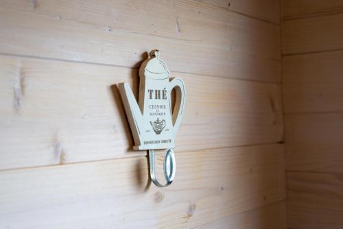 a key hanging on a wall at Vasarnamiai 2 in Šventoji