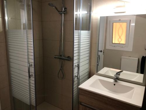 a bathroom with a sink and a shower at Apartaments els Pins - Sant Hilari Sacalm in Sant Hilari Sacalm