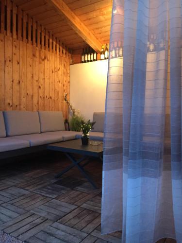 a living room with a couch and a table at Ferienhaus Perwolff in Eisenberg an der Pinka