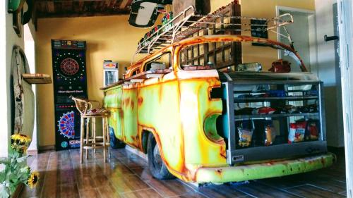 an old van with a ladder on top of it at SPACE 4 U - HOTEL BOUTIQUE TEMÁTICO - Aeroporto in São José dos Pinhais
