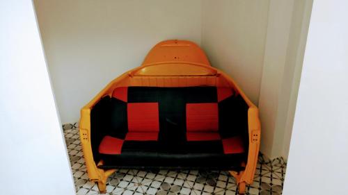 a bed in a corner of a room at SPACE 4 U - HOTEL BOUTIQUE TEMÁTICO - Aeroporto in São José dos Pinhais