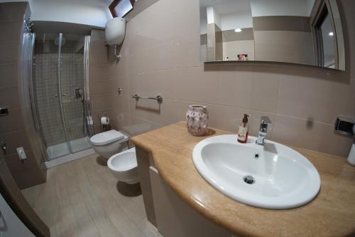 a bathroom with a sink and a toilet at Aiello house in Pompei
