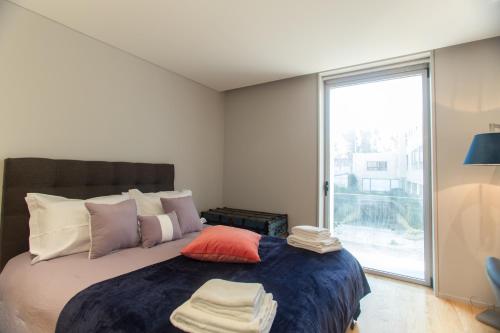 Postel nebo postele na pokoji v ubytování Premium Style Apt by Porto City Hosts