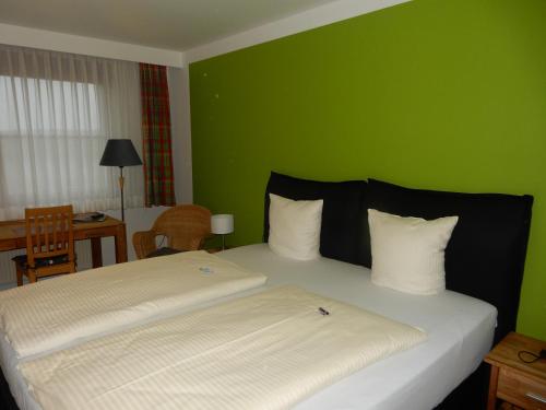 Ένα ή περισσότερα κρεβάτια σε δωμάτιο στο Hotel Frankenhöhe